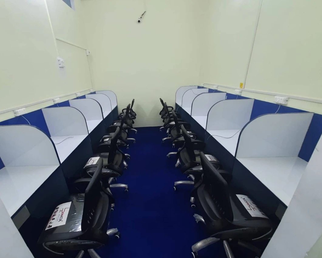 Study hall with rows of individual cabins at Sunrise Library Malendi